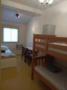 En eller flere køjesenge i et værelse på Hostel Pousada Rheingantz Rio Grande