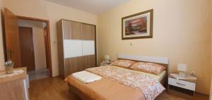 Krevet ili kreveti u jedinici u objektu Apartments New Charming