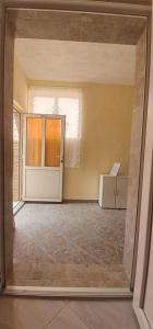 an empty room with a door and a window at Apartments New Charming in Senj