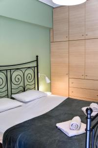 Postel nebo postele na pokoji v ubytování Homie Apartment next to Acropolis