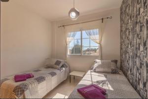 Postel nebo postele na pokoji v ubytování Villa Las Bahías + 37 fotografií