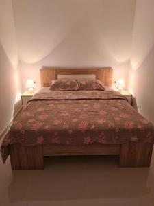 Postel nebo postele na pokoji v ubytování Apartmani Popivoda
