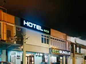a hotel ego sign on the side of a building at Hotel Eco Desaru in Desaru