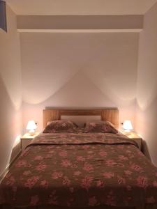 Postel nebo postele na pokoji v ubytování Apartmani Popivoda