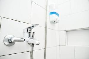 Koupelna v ubytování Tuju WK Homes Syariah + 20 fotografií