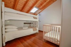 Postel nebo postele na pokoji v ubytování Contempora Apartments - Ca' Brenta Attic