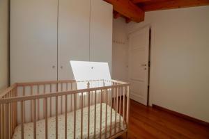 Postel nebo postele na pokoji v ubytování Contempora Apartments - Ca' Brenta Attic