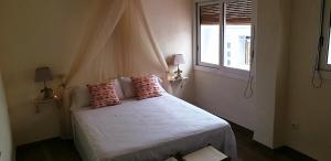 Postel nebo postele na pokoji v ubytování Les Llambrich - Apartamentos turísticos