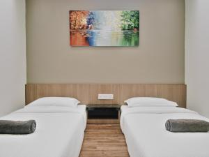 Postel nebo postele na pokoji v ubytování Hotel Eco Desaru