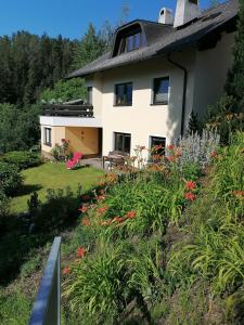 a house with a garden in front of it at Haus Reinstadler in Imst