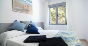 Ένα ή περισσότερα κρεβάτια σε δωμάτιο στο Apartamentos Conil Park +27 φωτογραφίες