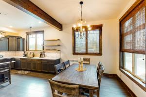a kitchen with a wooden table and chairs at Big Hill Retreat in Cle Elum