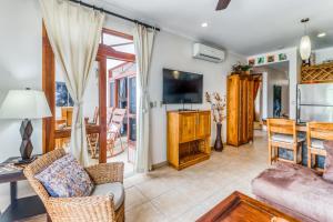 TV a/nebo společenská místnost v ubytování La Paloma Blanca D2