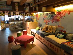 a living room filled with furniture and decor at Antwerp City Hostel in Antwerp