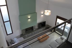 a staircase with a fireplace in a house at Villa Madodos con piscina privada, jacuzzi, barbacoa y chimenea in Riofrío