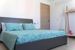 Postel nebo postele na pokoji v ubytování Acquachiara Rooms