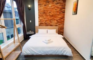Postel nebo postele na pokoji v ubytování Ngô Gia Home