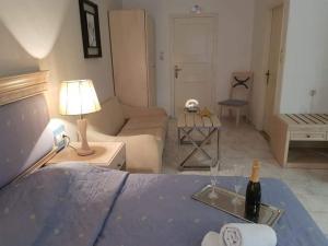 A bed or beds in a room at Arginonta Beach Apartments