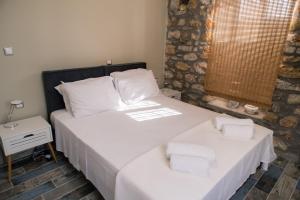 A bed or beds in a room at Nikolas place