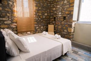 A bed or beds in a room at Nikolas place