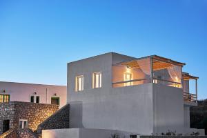 a view of a house with a building at Nirome Luxury Suites in Adamantas