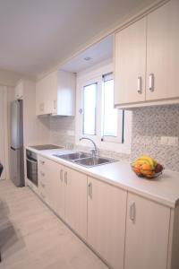 Kuchyň nebo kuchyňský kout v ubytování Mistral Apartments + 4 fotografie