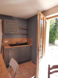 a kitchen with a sink and a counter top at Les métayers du Filou 2 in Castelnau-de-Montratier