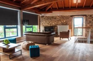 A seating area at O Forno Casa Ferrador Ribeira Sacra