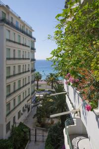 a view of the ocean from the balcony of a building at le capitole in Nice