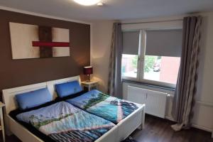 Postel nebo postele na pokoji v ubytování Moderne 3 Zimmer Wohnung - Zentral gelegen