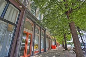 a street with a row of windows and a tree at Nulu Art District Loft Walk to Dtwn Distilleries! in Louisville