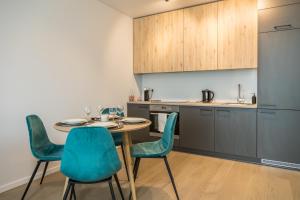 Kuchyň nebo kuchyňský kout v ubytování Apartment Hotel Laisve