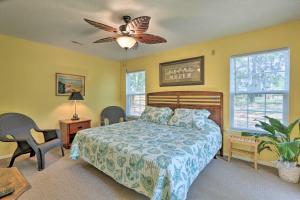 a bedroom with a bed and a ceiling fan at Downtown Home with Yard and BBQ - 6 Mi to Downtown! in Beaufort
