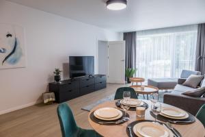 TV a/nebo společenská místnost v ubytování Apartment Hotel Laisve