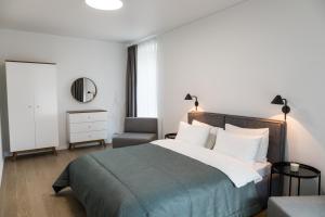 Postel nebo postele na pokoji v ubytování Apartment Hotel Laisve