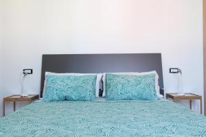 Postel nebo postele na pokoji v ubytování Acquachiara Rooms