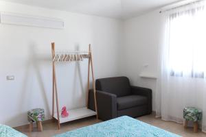 Postel nebo postele na pokoji v ubytování Acquachiara Rooms