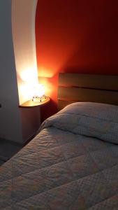 Postel nebo postele na pokoji v ubytování Casa Sant'Anna 24