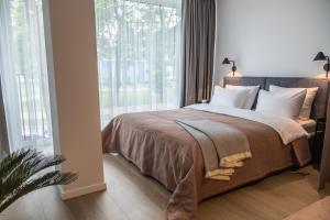 Postel nebo postele na pokoji v ubytování Apartment Hotel Laisve