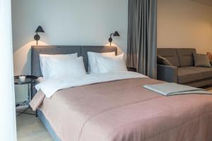Postel nebo postele na pokoji v ubytování Apartment Hotel Laisve