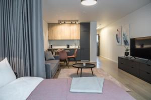 Postel nebo postele na pokoji v ubytování Apartment Hotel Laisve