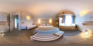 A bed or beds in a room at Dimora Sighé, exclusive rural villa with hydromassage pool
