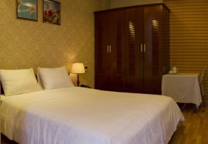 Postel nebo postele na pokoji v ubytování Anh Dao Mekong Hotel