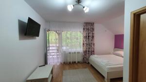 Postel nebo postele na pokoji v ubytování Casa Balint