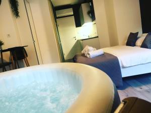 Posteľ alebo postele v izbe v ubytovaní Apartment Zagreb Jacuzzi