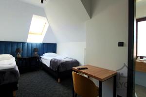 Łóżko lub łóżka w pokoju w obiekcie Lyck Apartamenty