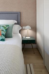 Posteľ alebo postele v izbe v ubytovaní Hygge by FeelFree Rentals