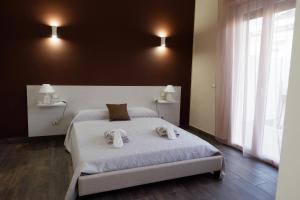 Postel nebo postele na pokoji v ubytování B&B Leus Appartment