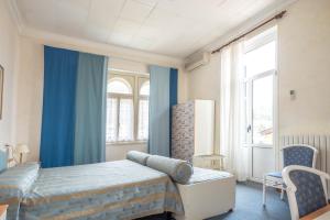 Postel nebo postele na pokoji v ubytování Hotel Maderno