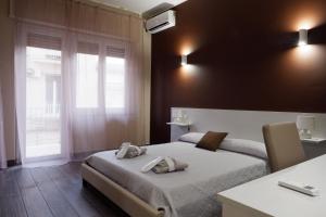 Postel nebo postele na pokoji v ubytování B&B Leus Appartment